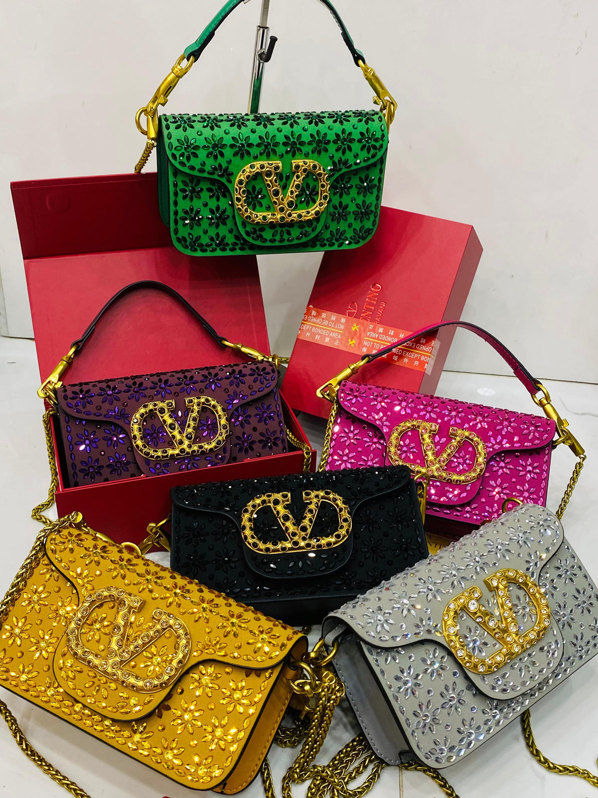 Valentino Garavani Locò velvet clutch with jewel logo