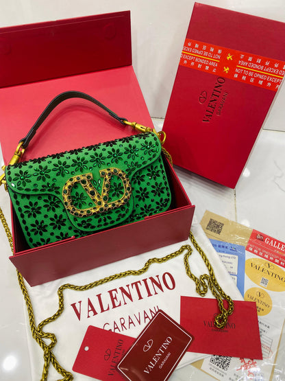Valentino Garavani Locò velvet clutch with jewel logo