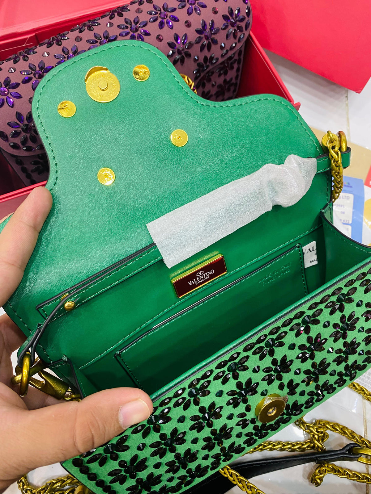 Valentino Garavani Locò velvet clutch with jewel logo