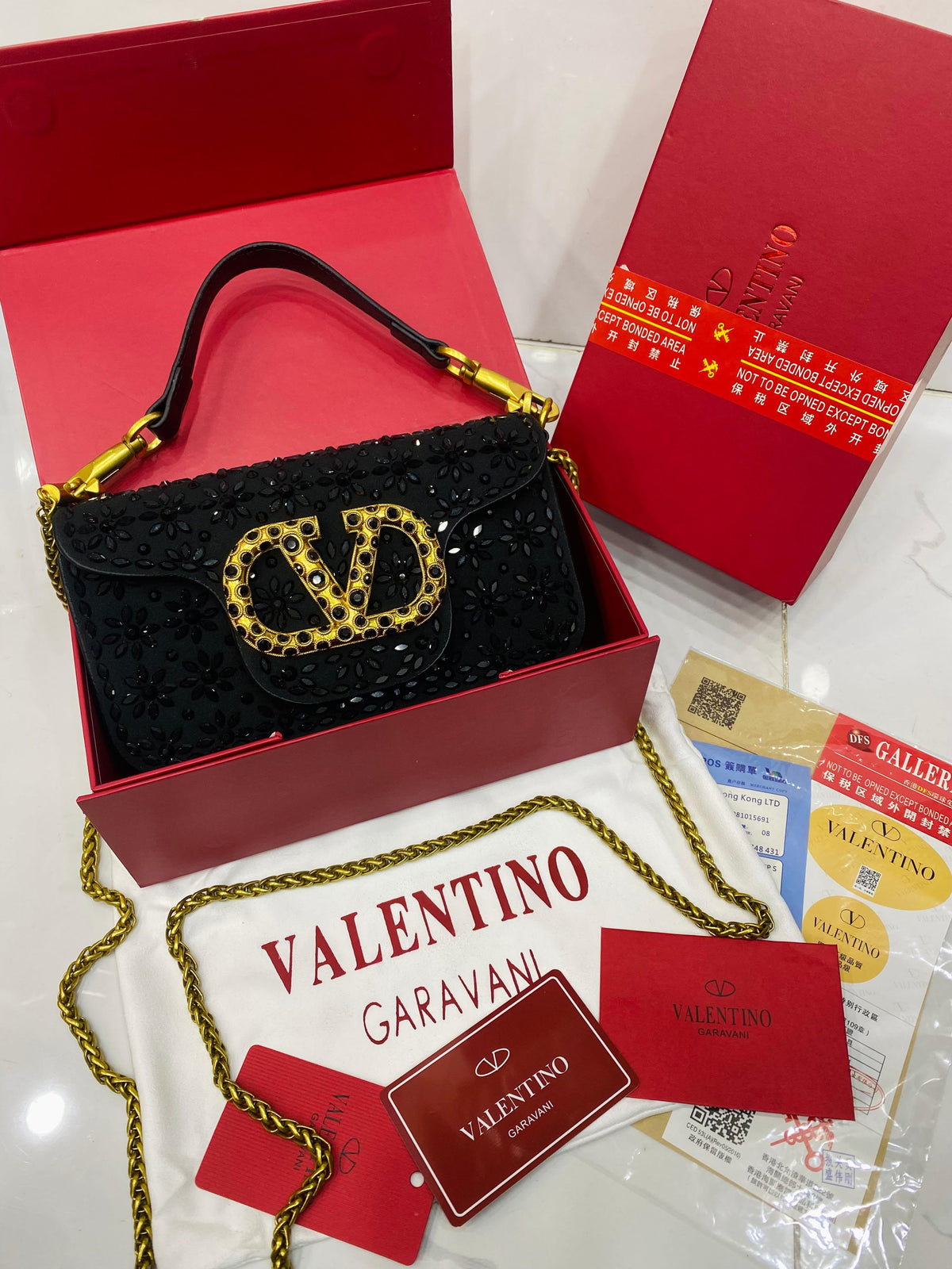 Valentino Garavani Locò velvet clutch with jewel logo