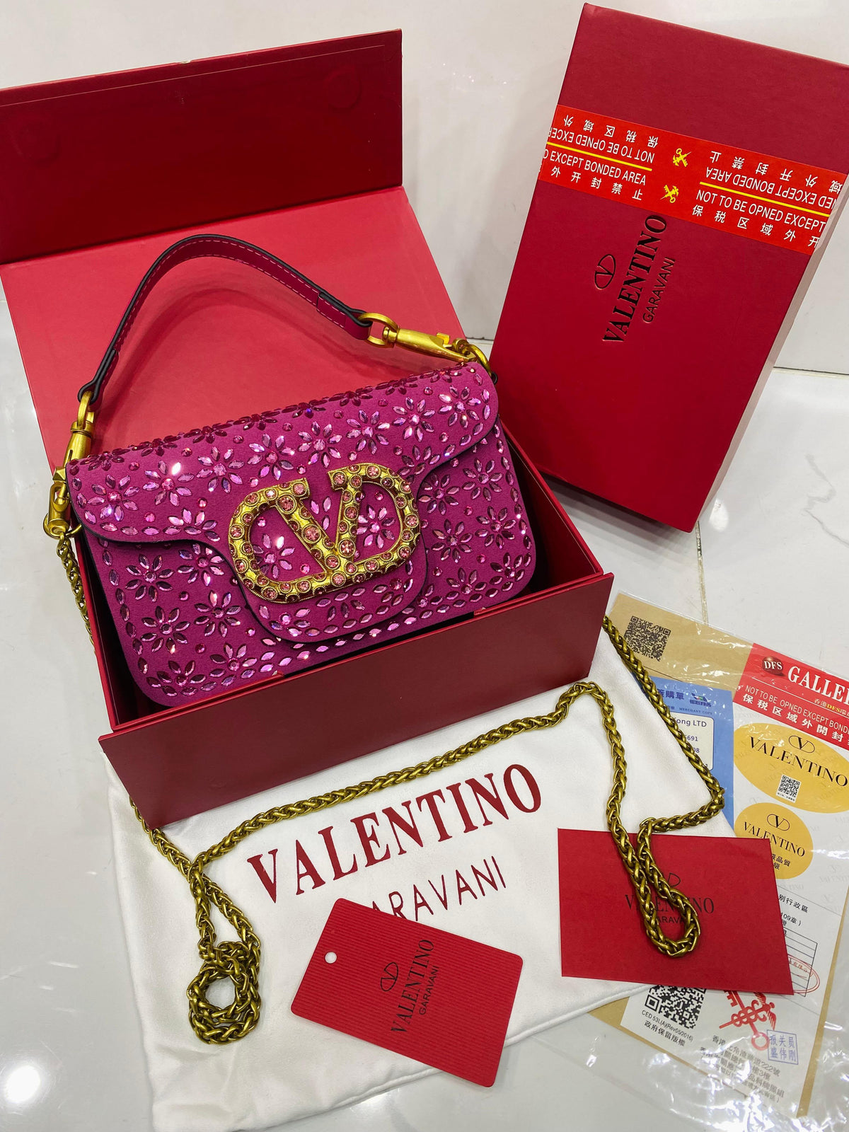 Valentino Garavani Locò velvet clutch with jewel logo