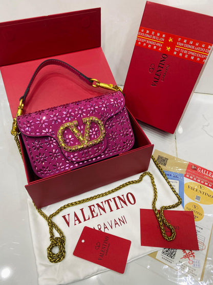 Valentino Garavani Locò velvet clutch with jewel logo