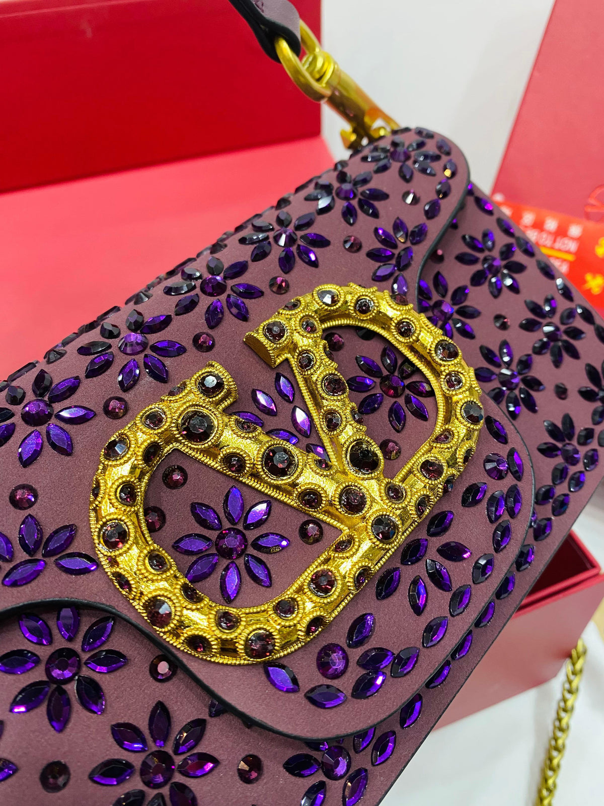 Valentino Garavani Locò velvet clutch with jewel logo