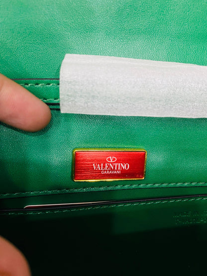 Valentino Garavani Locò velvet clutch with jewel logo